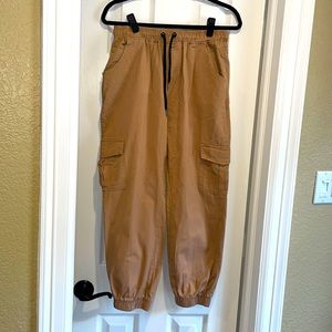 A pair of tan joggers